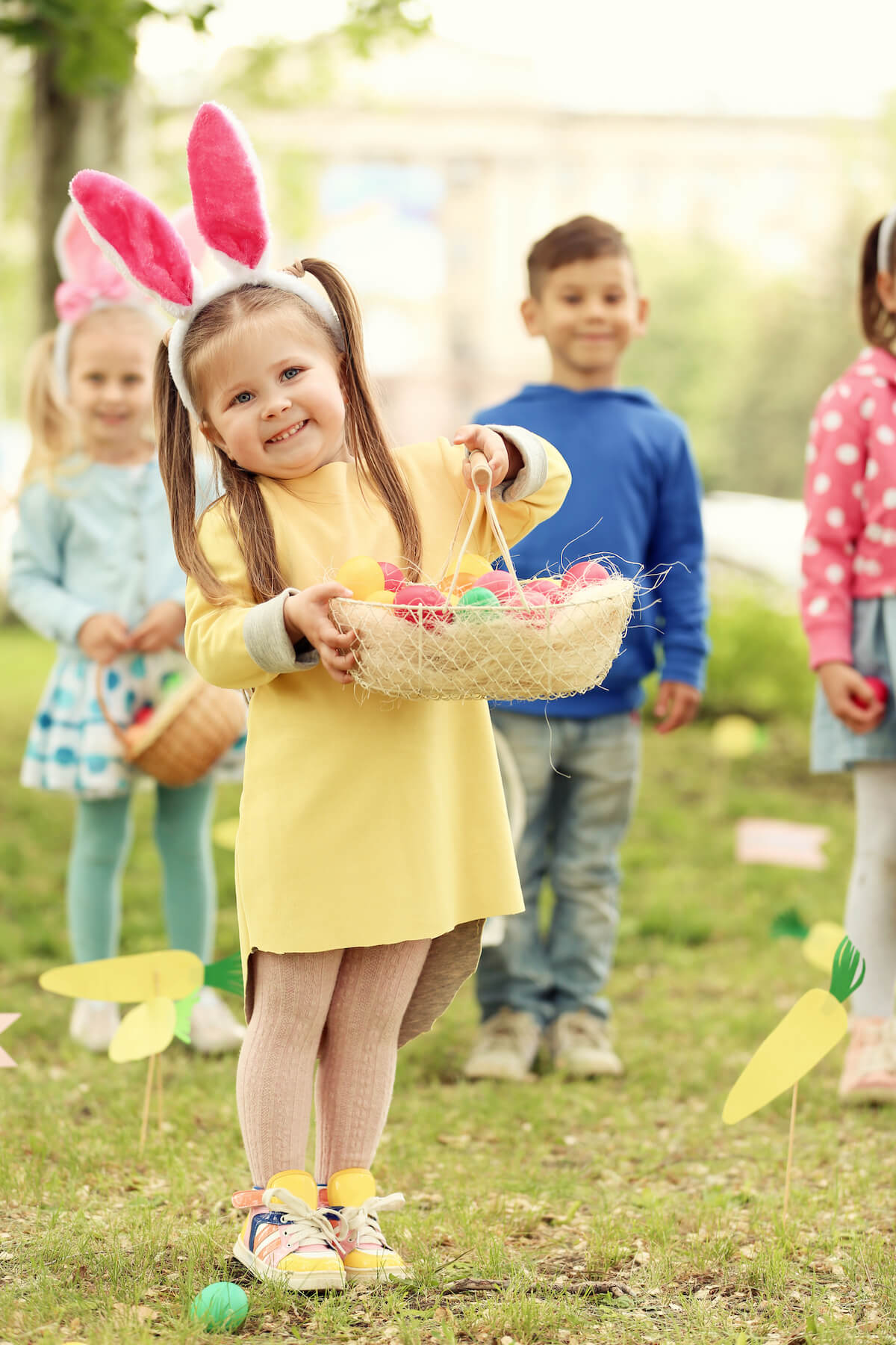 kids with baskets of easter eggs during an easter egg hunt