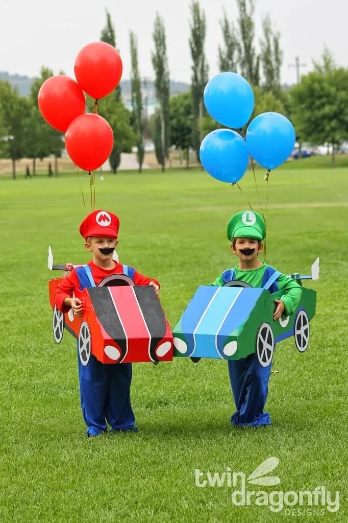 homemade mario kart costume for mario and luigi made using cardboard boxes and helium balloons.