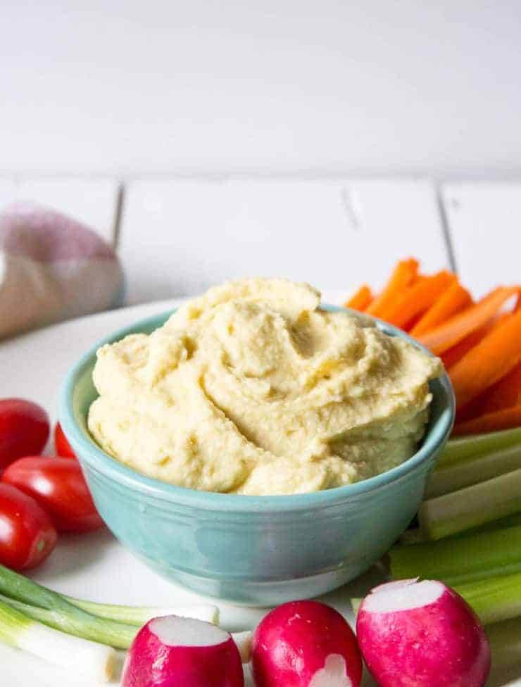 hummus and veggies on a plate