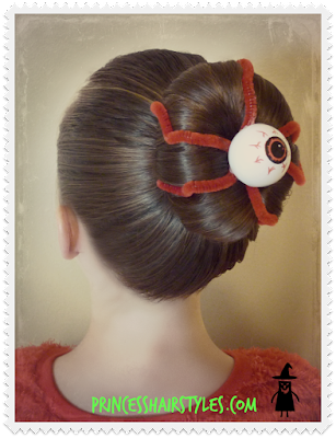 silly eyeball hairstyle with a bun and pipe cleaners.