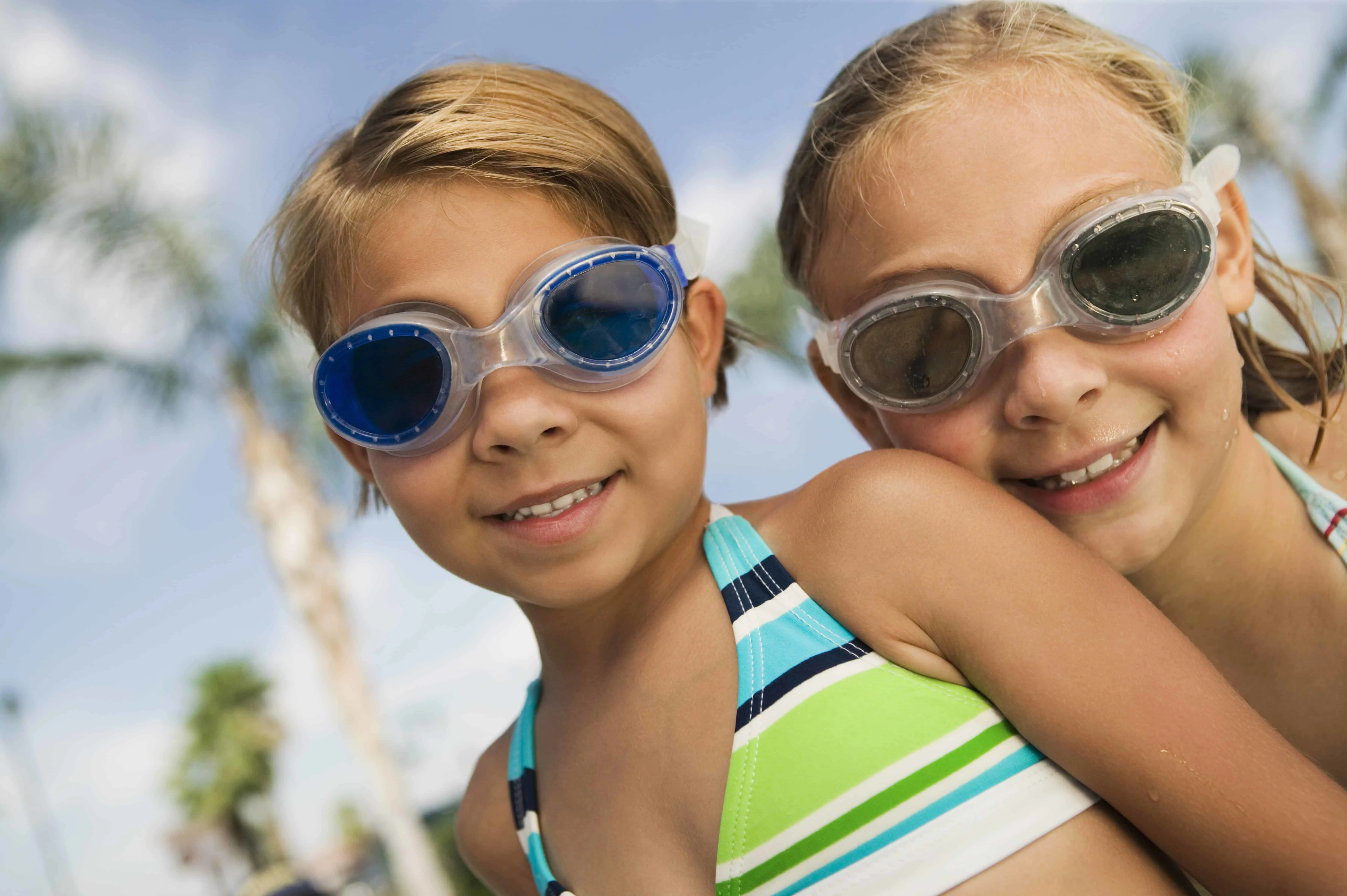 Two girls with googles at the pool