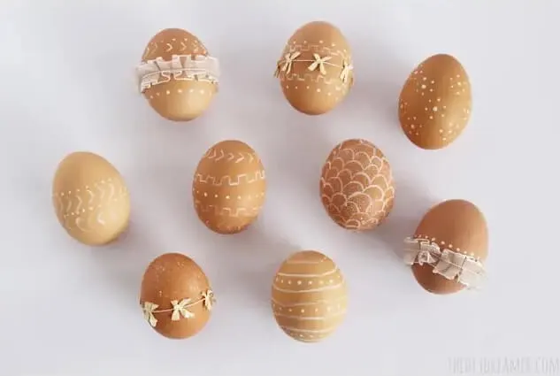 rustic easter eggs with ribbon and white paint