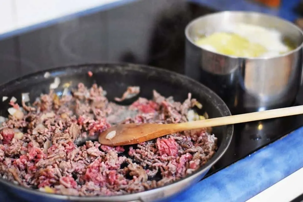 cook mince and soften potatoes